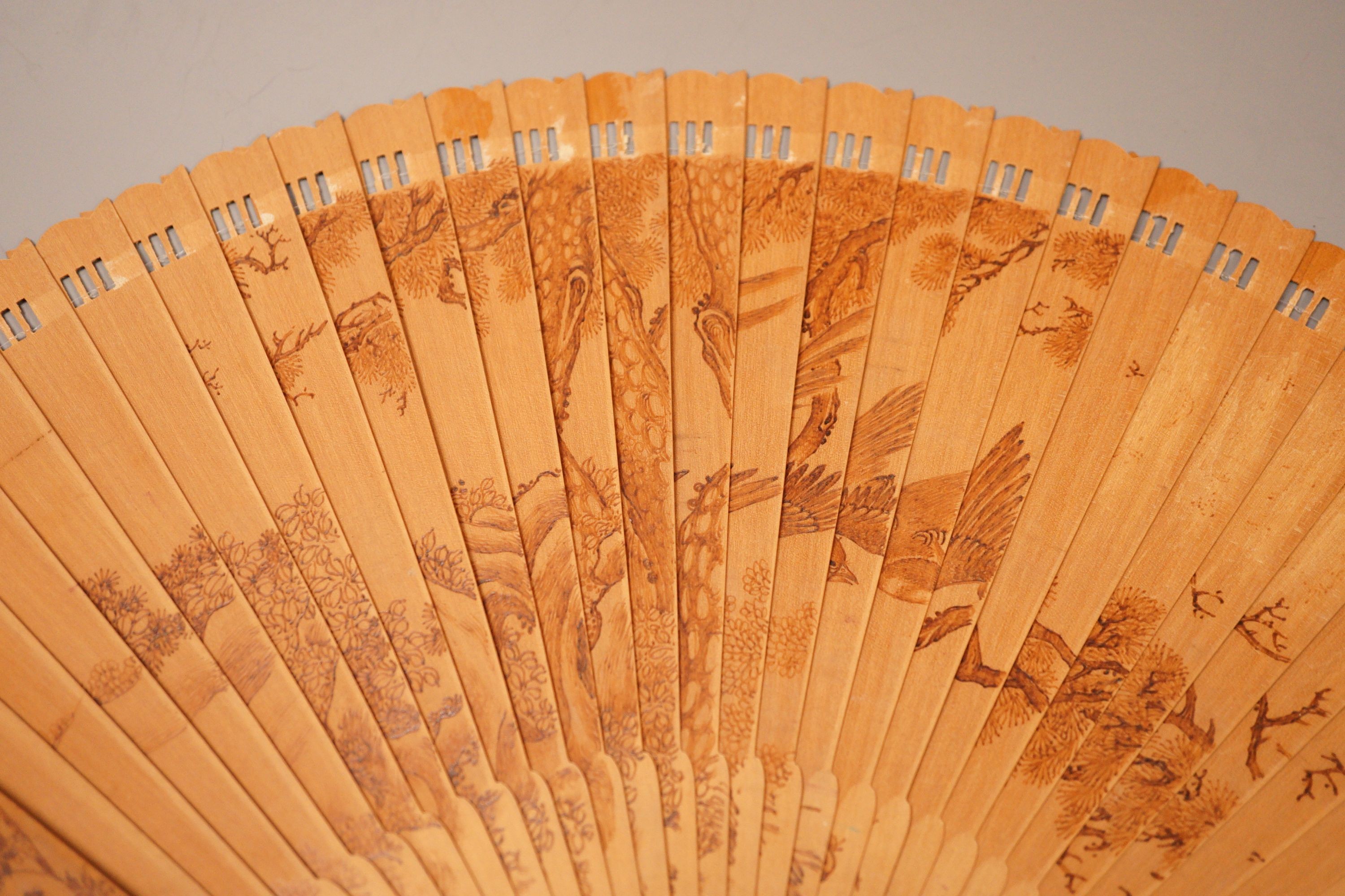A Chinese penwork sandalwood fan